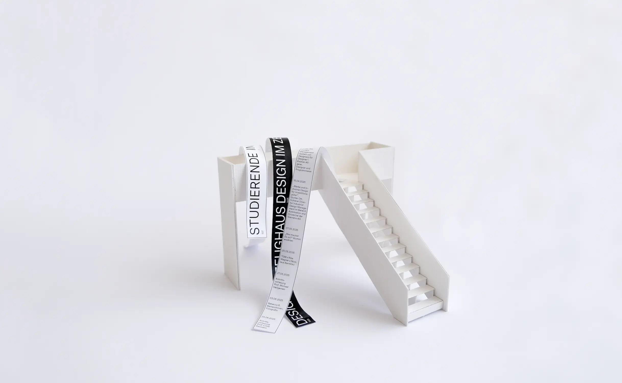 3D-paper model with black paper banner on it